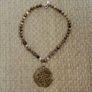 Asian inspired stone beaded necklace with carved stone medallion